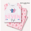 A folded children's pajama set on a light beige background, featuring a white raglan top with pink sleeves and a cartoon character graphic, paired with matching pink pajama pants printed with bows and hearts. The text 'ThePersonalisedStore LONDON' is visible in the top right.